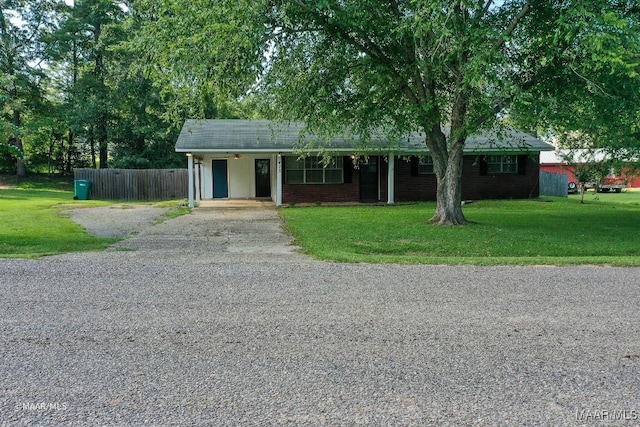 ranch-style home featuring a front yard