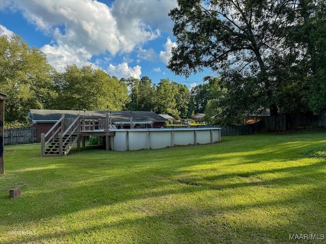 view of yard featuring a pool side deck