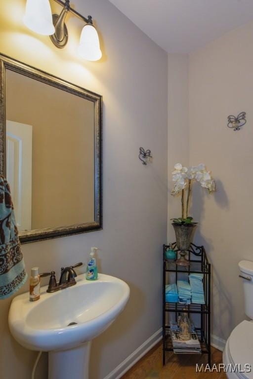 bathroom featuring sink and toilet