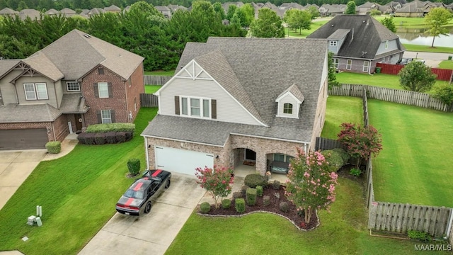 view of front facade featuring a front yard and a water view