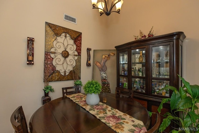 dining area featuring a notable chandelier