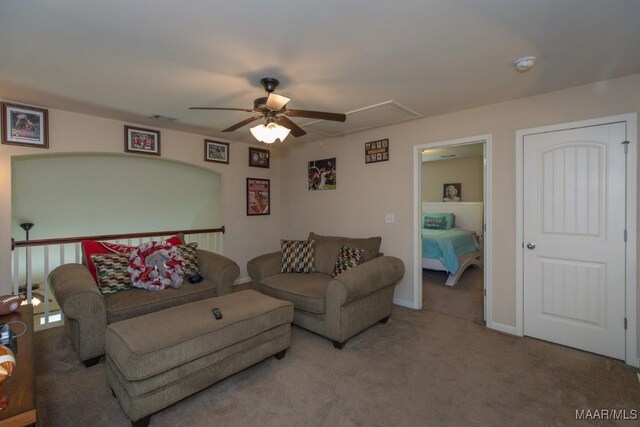 living room featuring carpet and ceiling fan