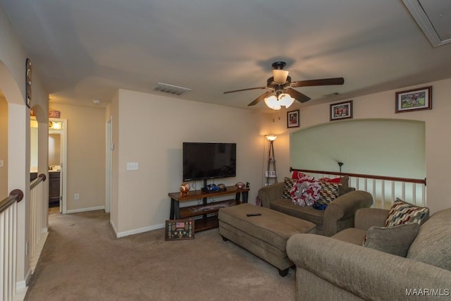 carpeted living room featuring ceiling fan