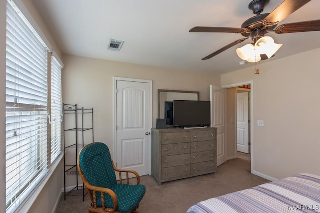 bedroom featuring ceiling fan and light colored carpet