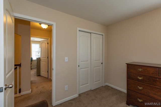 carpeted bedroom featuring a closet