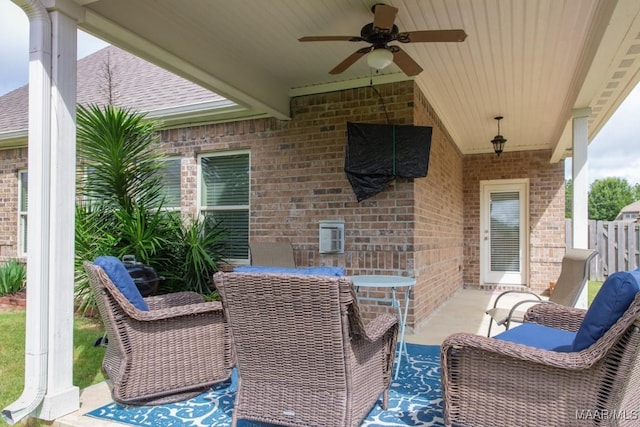 view of patio featuring ceiling fan