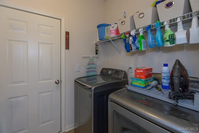 laundry room featuring separate washer and dryer