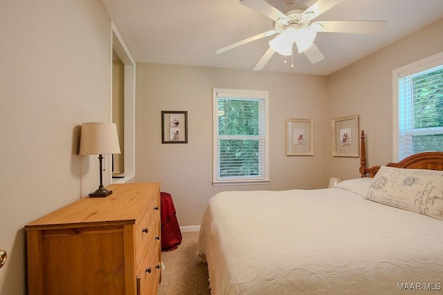 bedroom with ceiling fan and carpet flooring