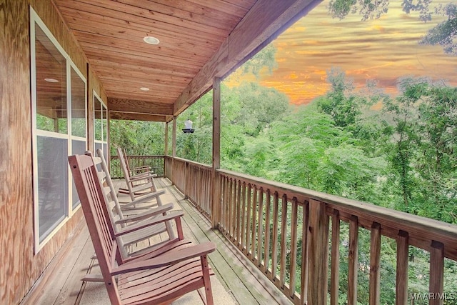 view of balcony at dusk