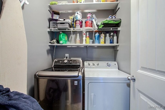 laundry area with separate washer and dryer