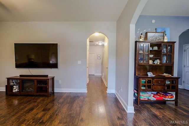 living room with dark hardwood / wood-style floors