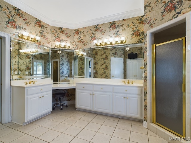 bathroom with vanity, a shower with door, tile patterned flooring, and crown molding