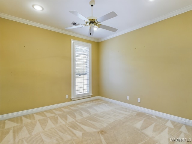 empty room with light carpet, crown molding, and ceiling fan