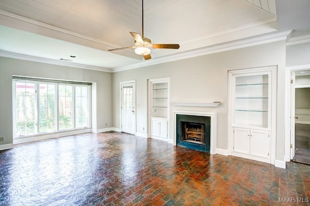 unfurnished living room with ornamental molding, built in features, and ceiling fan