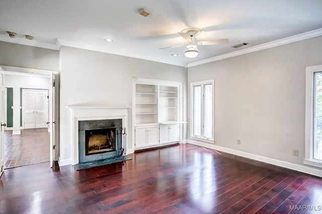 unfurnished living room featuring ceiling fan, dark hardwood / wood-style floors, and plenty of natural light