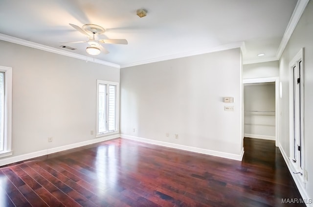 unfurnished room with ornamental molding, ceiling fan, and dark hardwood / wood-style floors