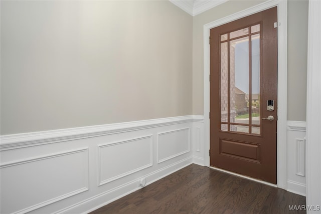 foyer with dark hardwood / wood-style floors and ornamental molding