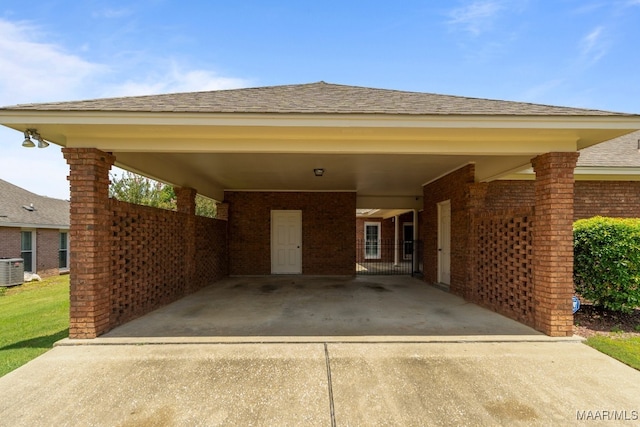 view of front of property featuring a carport and central air condition unit