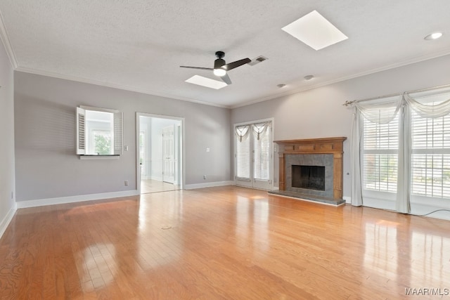 unfurnished living room with a healthy amount of sunlight and hardwood / wood-style floors