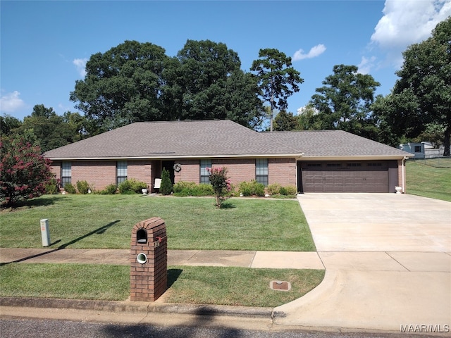 ranch-style house with a garage and a front yard