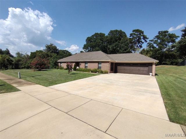 view of front of house with a garage and a front yard