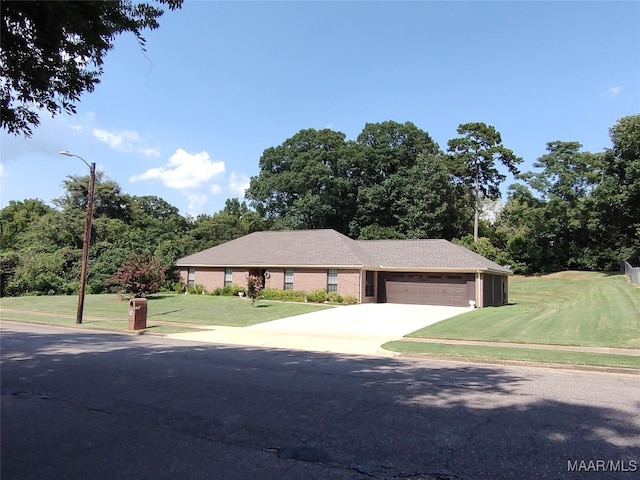 single story home with a garage and a front yard