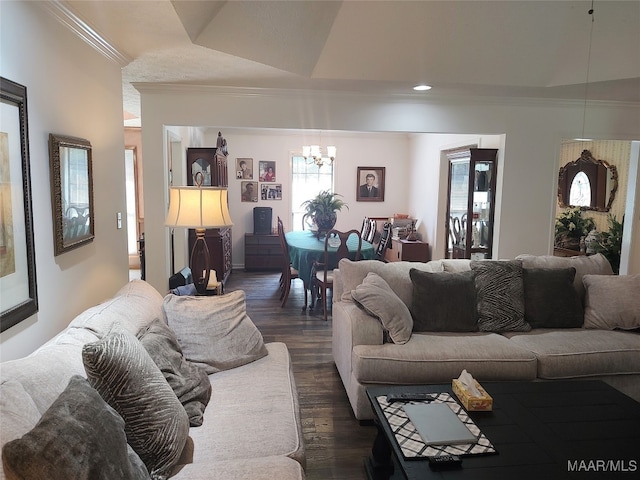 living room featuring a chandelier, dark hardwood / wood-style floors, a raised ceiling, and a wealth of natural light