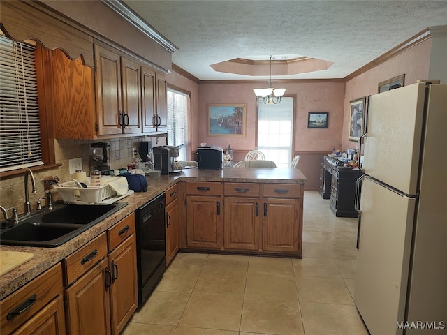 kitchen with decorative backsplash, white refrigerator, crown molding, and a wealth of natural light