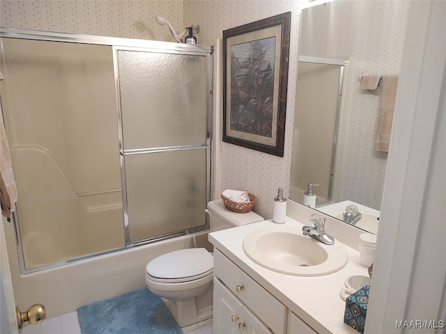 full bathroom featuring vanity, enclosed tub / shower combo, toilet, and tile patterned floors