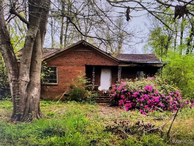 view of front of home with brick siding