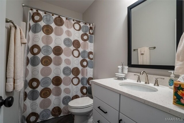 bathroom with vanity and toilet