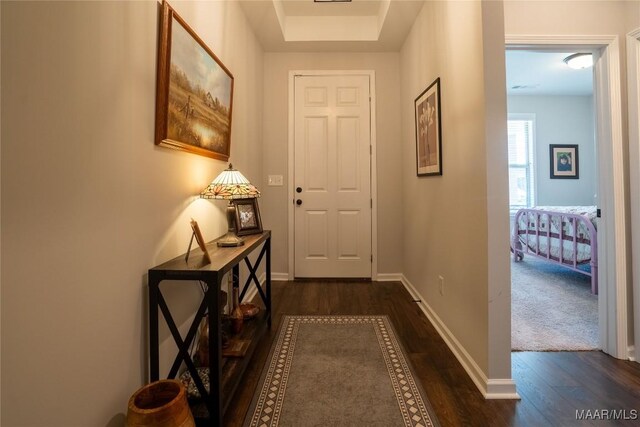 corridor featuring dark hardwood / wood-style flooring