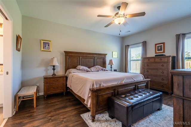 bedroom featuring dark hardwood / wood-style floors and ceiling fan