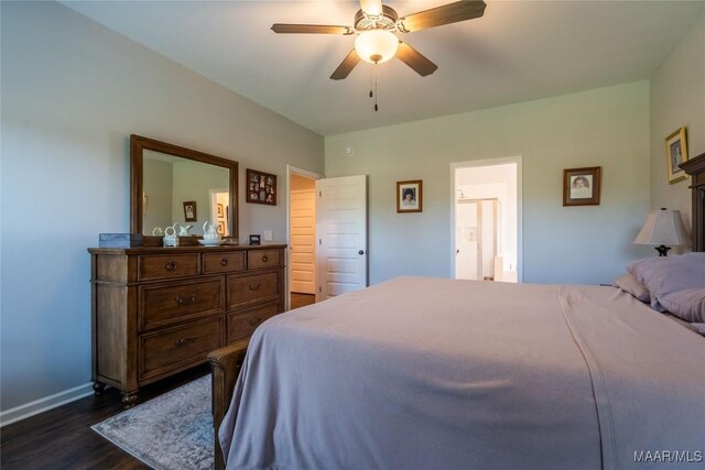 bedroom with ceiling fan, ensuite bathroom, and dark hardwood / wood-style floors