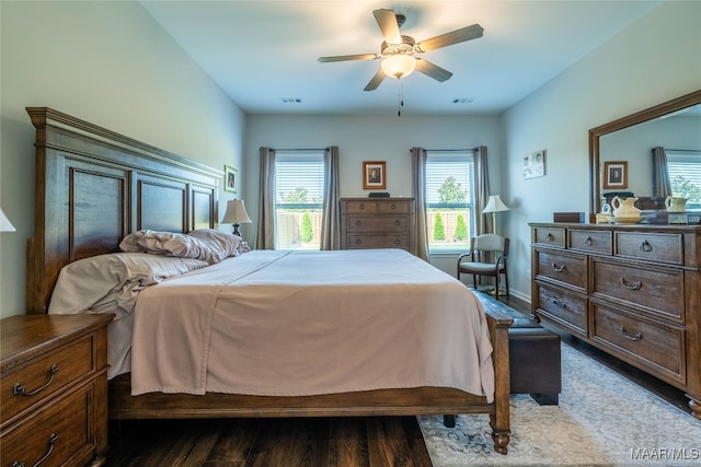 bedroom with hardwood / wood-style flooring and ceiling fan