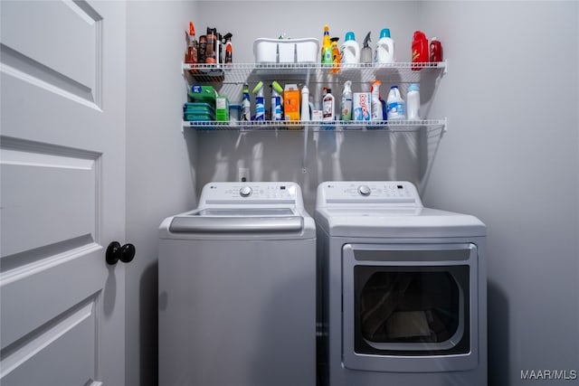 laundry area with washing machine and dryer