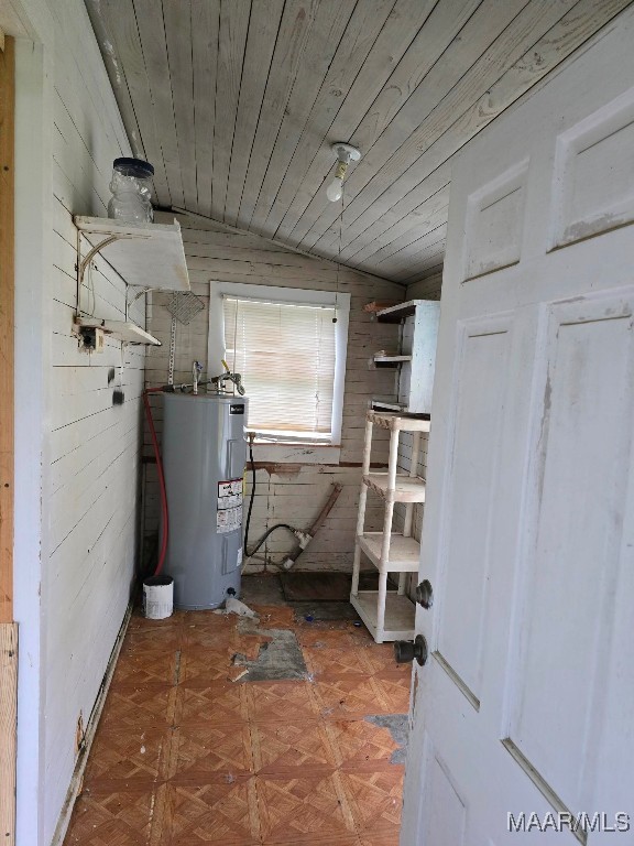 utility room featuring water heater