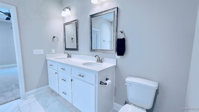 bathroom featuring vanity and toilet