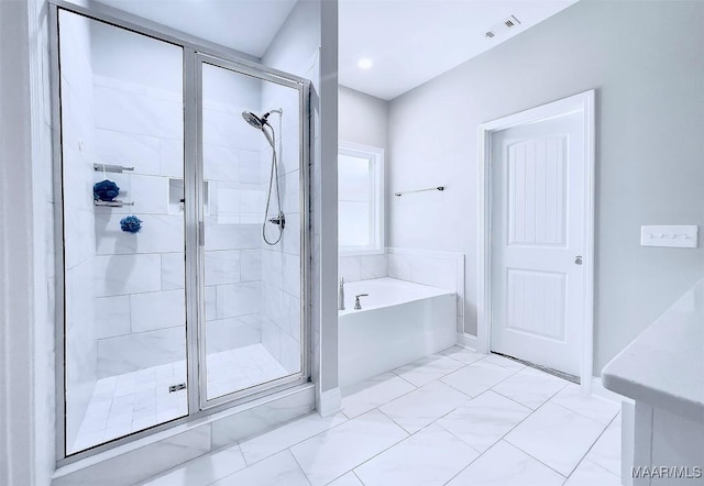 bathroom featuring plus walk in shower and vanity