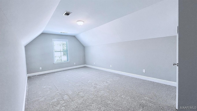 bonus room featuring lofted ceiling and carpet floors