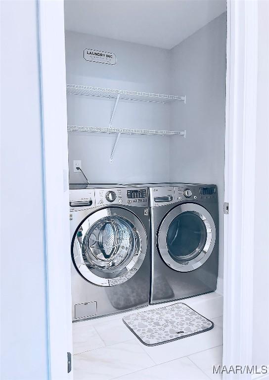 laundry room with independent washer and dryer