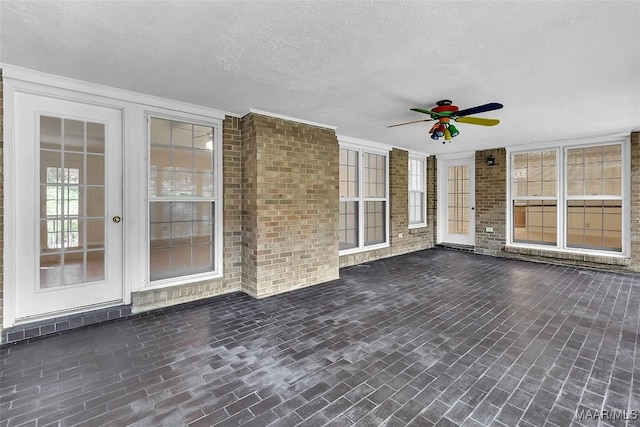 view of patio featuring ceiling fan