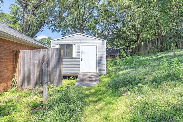 view of outdoor structure with a yard