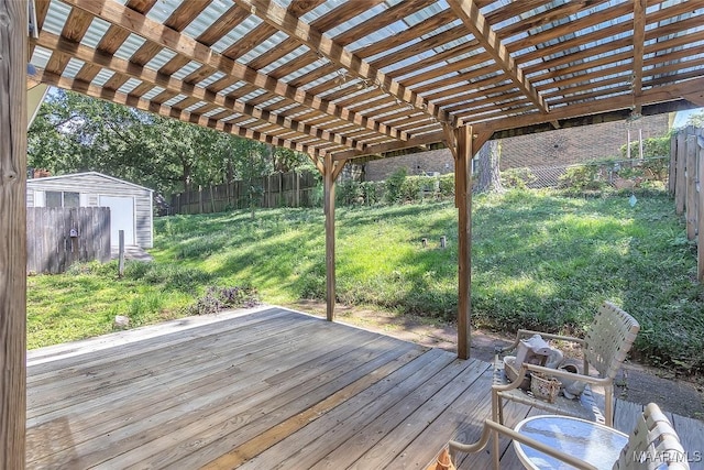 deck featuring a yard and a pergola