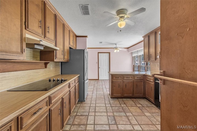 kitchen with crown molding, tasteful backsplash, black electric cooktop, stainless steel refrigerator, and kitchen peninsula