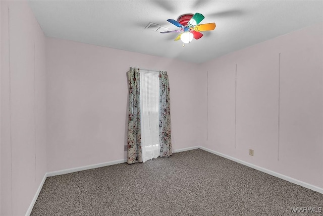 empty room featuring ceiling fan and carpet floors