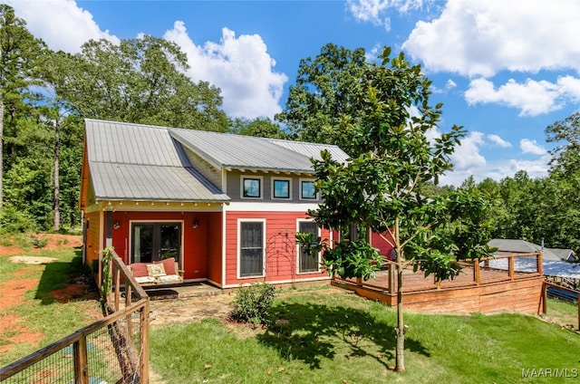 1086 Riverknolle Rd, Tallassee, AL 36078 - back of property featuring a yard and metal roof