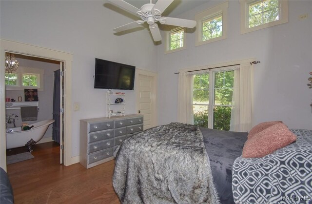 1086 Riverknolle Rd, Tallassee, AL 36078 - bedroom with a ceiling fan, a high ceiling, and wood finished floors