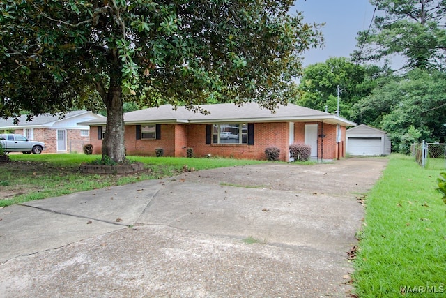 single story home with a front yard and a garage