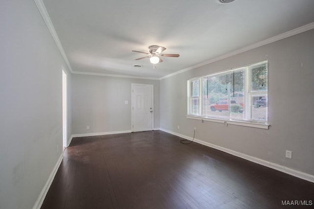 unfurnished room with ornamental molding, dark wood-style flooring, ceiling fan, and baseboards